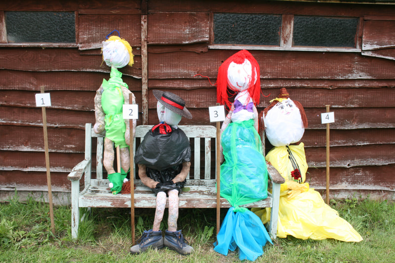 Four scarecrows - Tinkerbell, Mary Poppins, Ariel and Belle from Beauty and the Beast